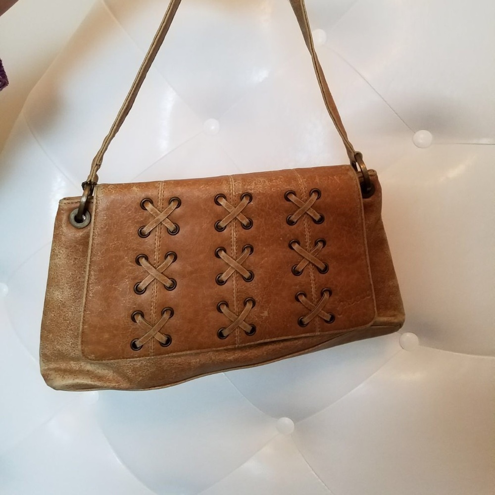 Worn out looking Guess bag.
